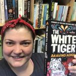 Charlotte holding White Tiger book