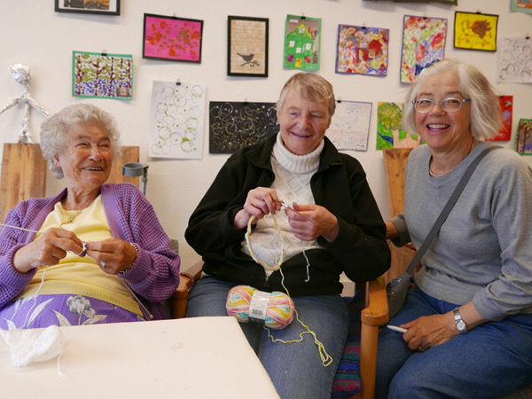 Joyce knitting with members of the Mill Knitters Group