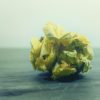 A ball of scrunched up yellow writing paper