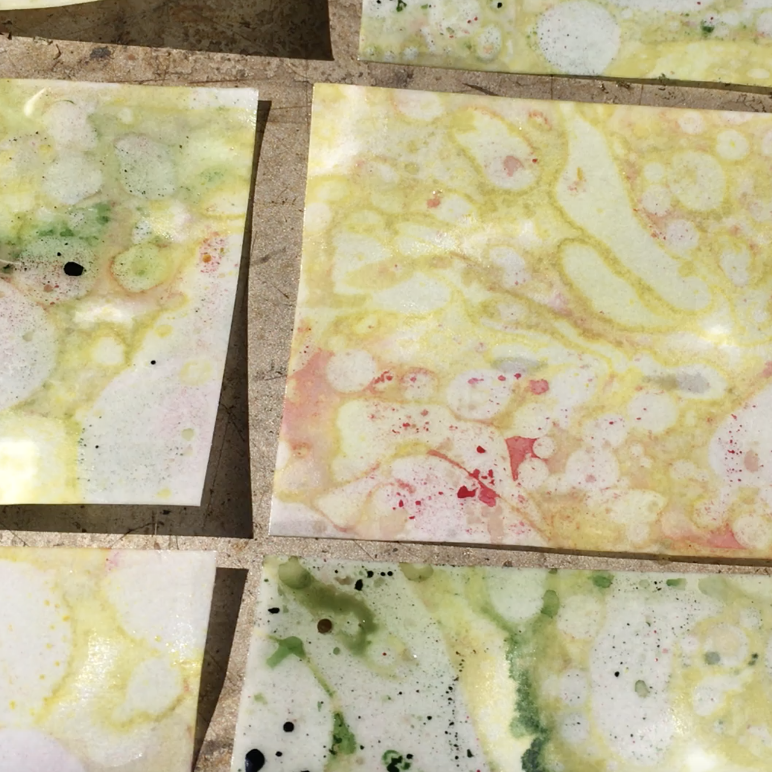 Marbled paper in multicolours, spread out a drying in the sun