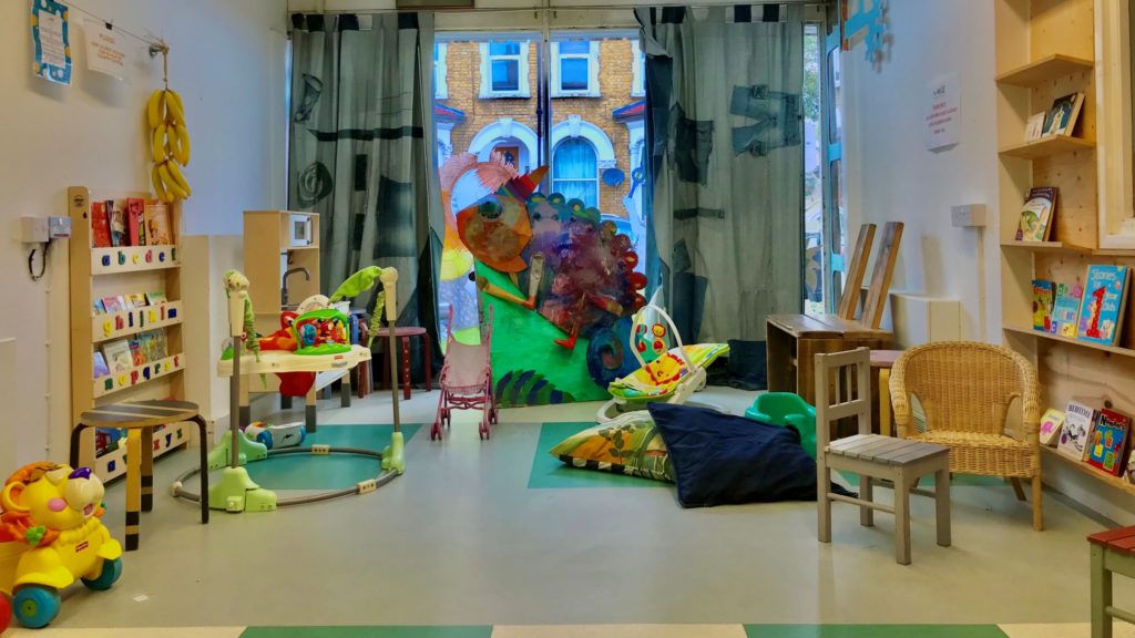 The Mill Children's Room, with a selection of toys and books laid out, ready for play.