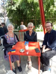 Mo and Alison from The Mill having a coffee with Lewis from Assemble at an outside cafe